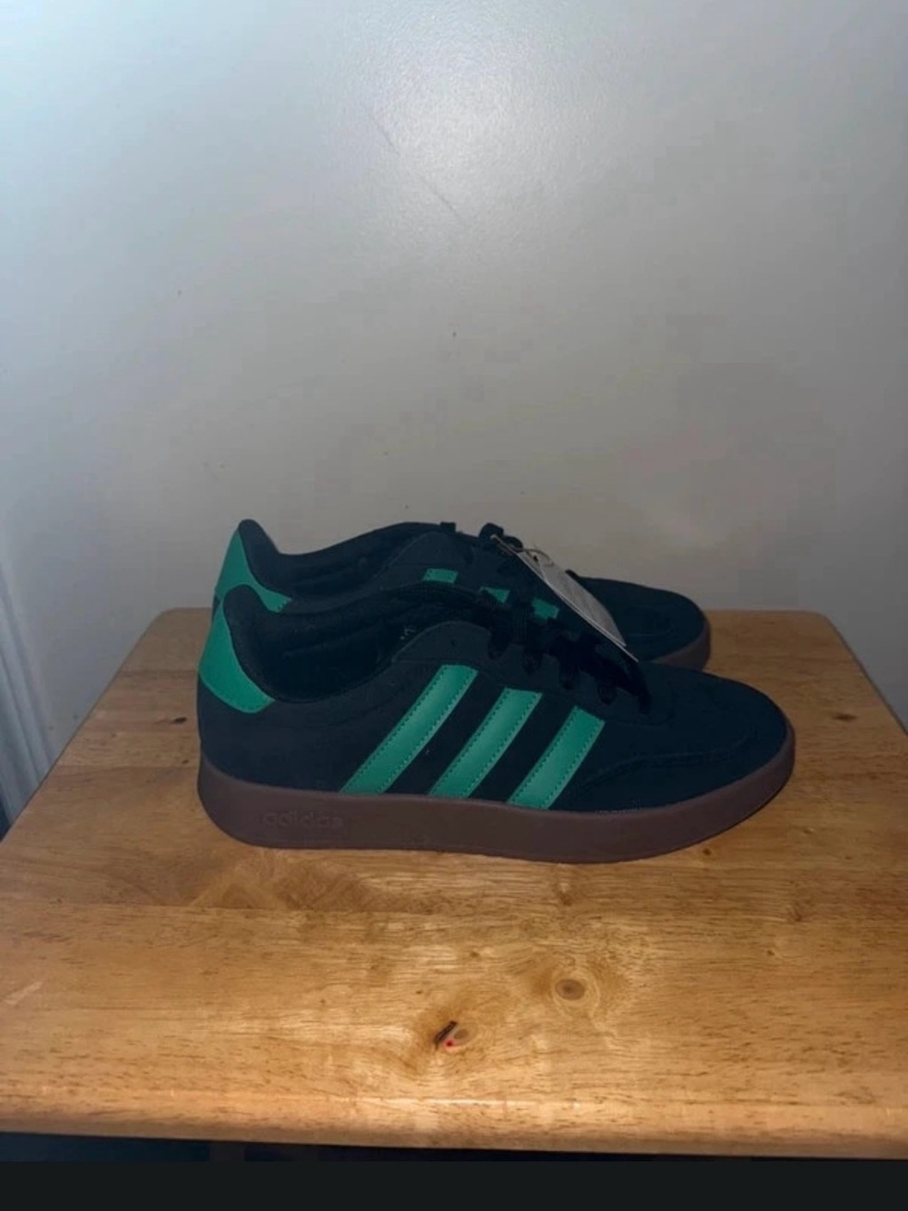 Men’s size 10 Adidas Barreda sneakers in black with green stripes